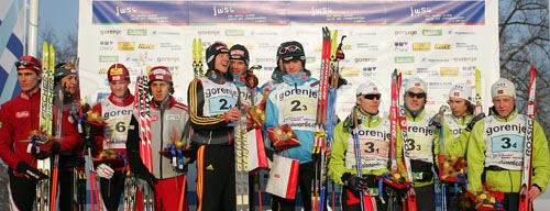 Winner team of Germany with members Toni Englert, Ruben Welde, Stefan Tuss and Tom Beetz (M), second placed team Austria with members Tomaz Druml, Tobias Kammerlander, Marco Pichlmayr and Alfred Rainer (L), and third placed Norway with members Jonas Nermoen, Joakim Aakvik, Torkil Rasmussen Aam and Thomas Kjelbotn (R) celebrating their medals after Junior Nordic Combined Ski World Championship team race, which was held in Kranj (ski jumping) and Medvode (cross country skiing), Slovenia.
