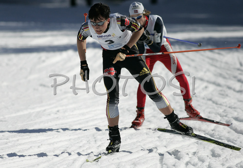 Ruben Welde of Germany and Glenn Arne Sollid of Norway skiing in Nordic combined relay race of Junior Nordic skiing World Championships in Tarvisio, Italy. Nordic combined relay race of Junior Nordic skiing World Championships in Tarvisio, Italy was held on 16th of March 2007 in Fusine, Italy. Due warm weather and lack of snow, cross country skiing races of Junior Nordic skiing World Championships 2007 were moved from Tarvisio, Italy to Fusine, Italy.
