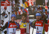 Winner Martin Fourcade of France (M), second placed Simon Schempp of Germany (L) and third placed Anton Shipulin of Russia celebrate their success in finish of the Men pursuit race of IBU Biathlon World Cup in Hochfilzen, Austria. Men sprint race of IBU Biathlon World cup was held on Saturday, 12th of December 2015 in Hochfilzen, Austria.
