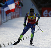 Winner Martin Fourcade of France crossing finish line of the Men pursuit race of IBU Biathlon World Cup in Hochfilzen, Austria. Men sprint race of IBU Biathlon World cup was held on Saturday, 12th of December 2015 in Hochfilzen, Austria.
